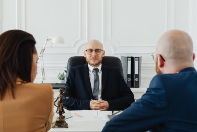 Franchisees evaluating an experienced franchise attorney during a consultation