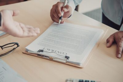 Attorney reviewing a franchise disclosure document and agreement clauses