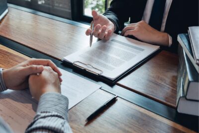 Federal employment lawyer reviewing an MSPB appeal with a federal employee client