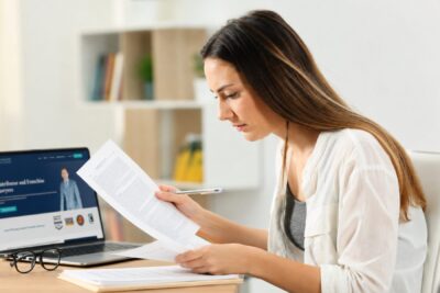 Prospective franchisee reading a franchise disclosure document closely, the kind of FDD review a broker or AI summary cannot replace