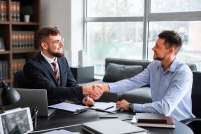 Franchise attorney meeting with a client about a franchise agreement during an FDD review consultation