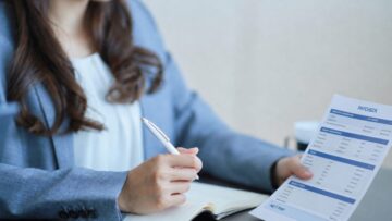 Salaried employee reviewing a paycheck to determine whether overtime pay was included under FLSA rules.