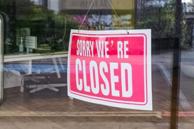 Closed sign at a franchise location following termination or non-renewal