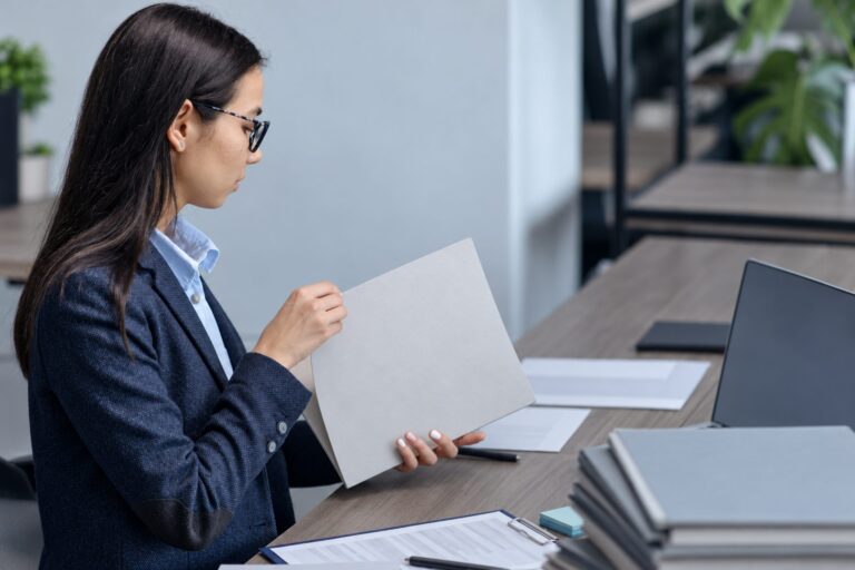 Executive reviewing a garden leave agreement at her desk under the Florida CHOICE Act